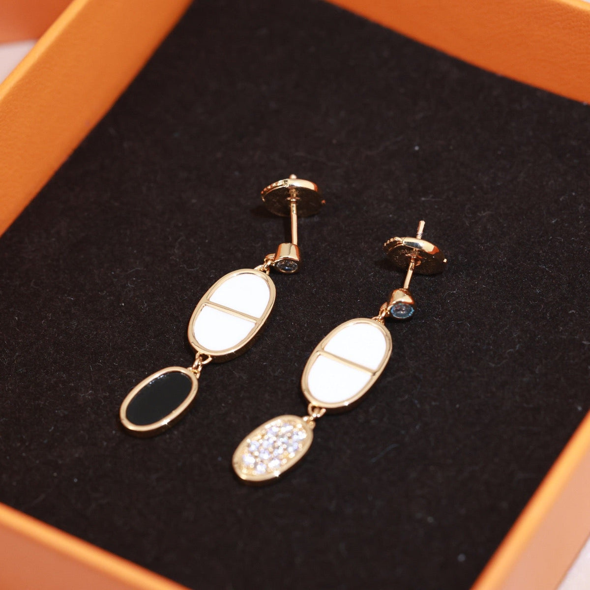 Martin Graham stud earrings in polished metal-tone – front product view