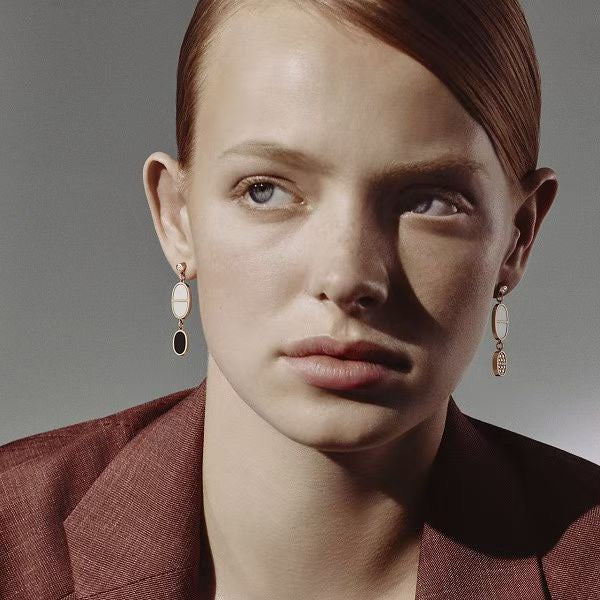 Martin Graham stud earrings in polished metal-tone – detail view