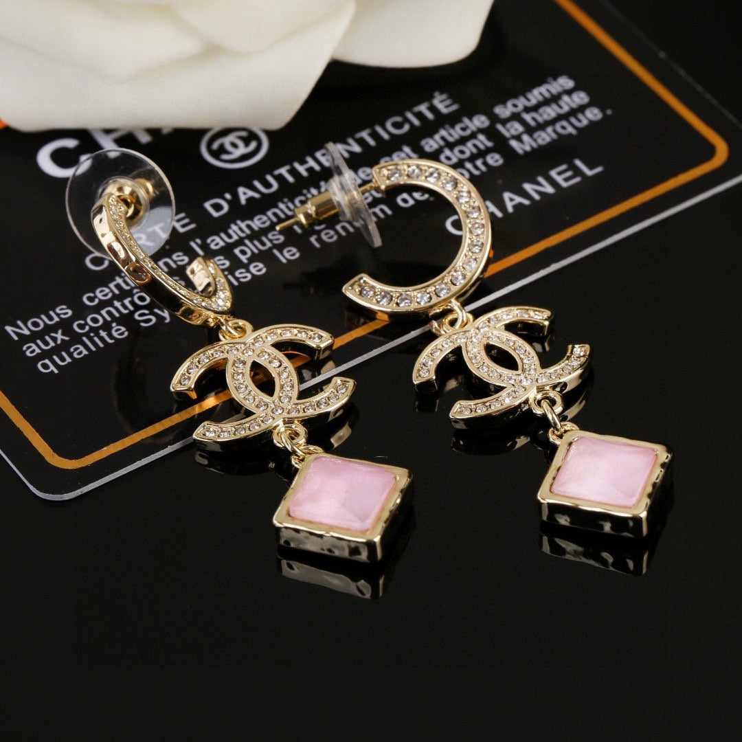 Martin Graham Double-C earrings in gold-tone – close-up detail