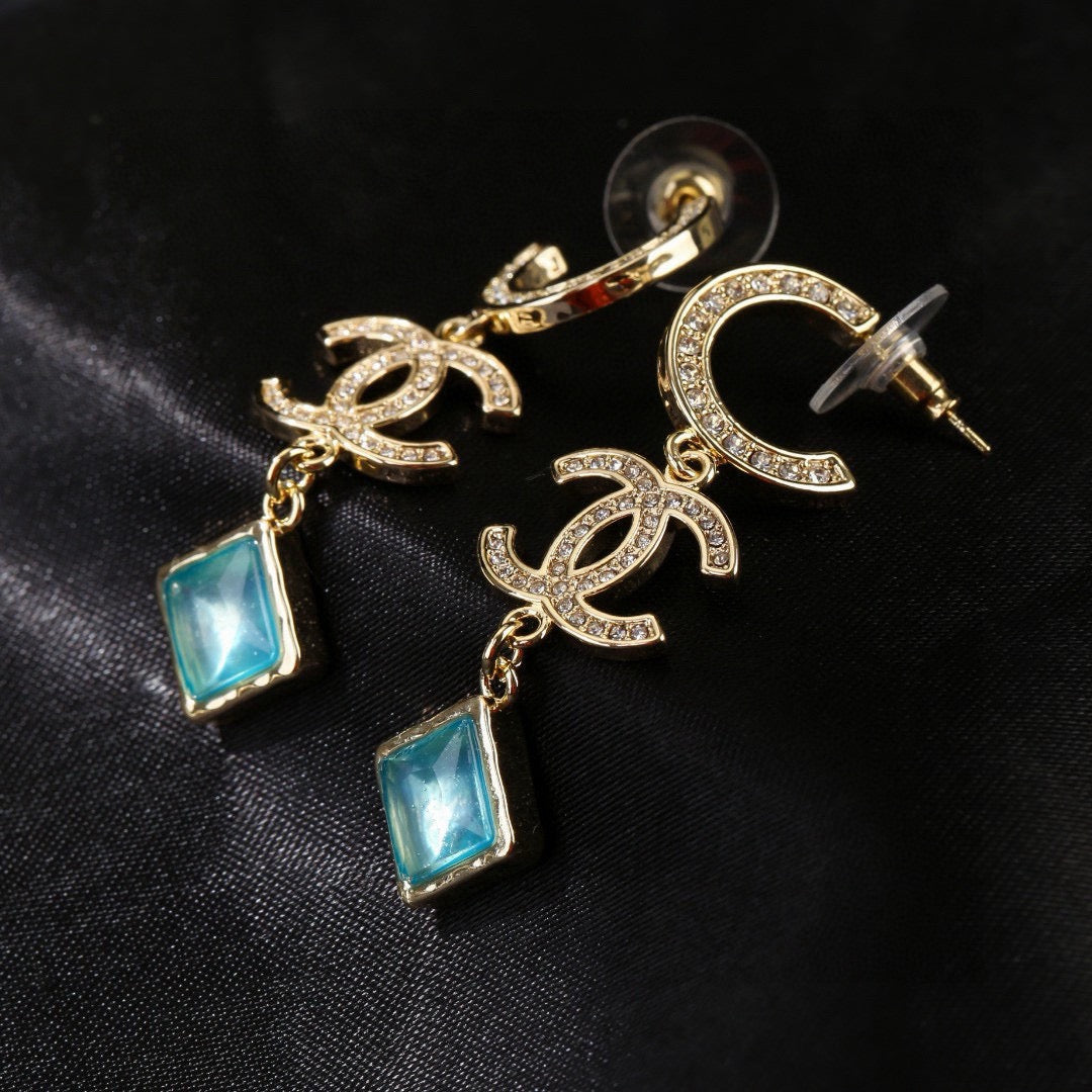 Martin Graham Double-C earrings in gold-tone – front product view