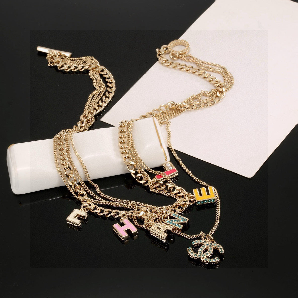 Martin Graham pendant necklace in polished metal-tone – close-up detail