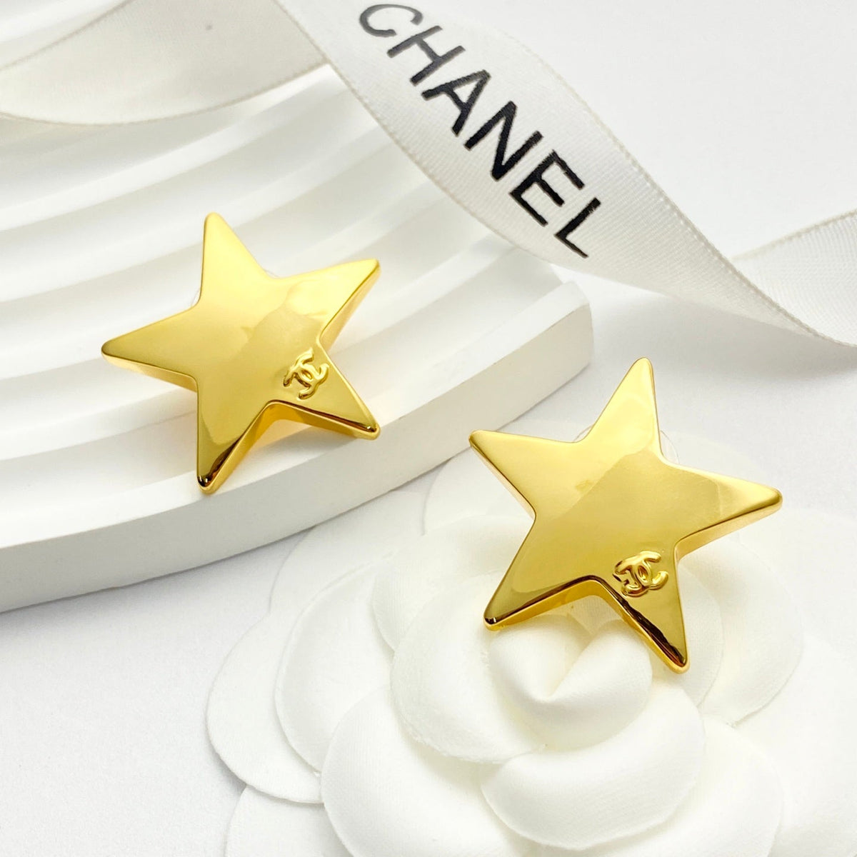 Martin Graham stud earrings in polished metal-tone – front product view