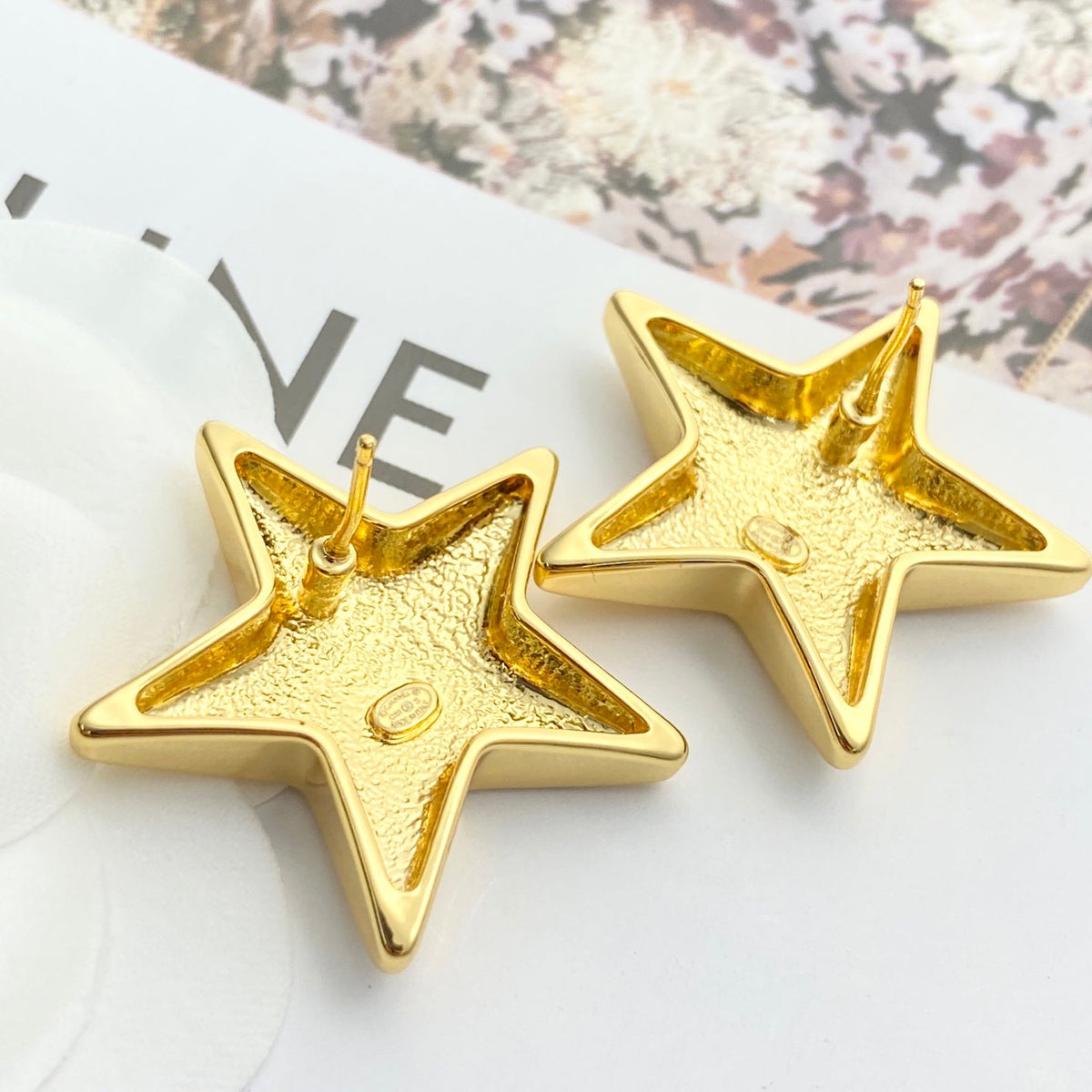 Martin Graham stud earrings in polished metal-tone – side detail