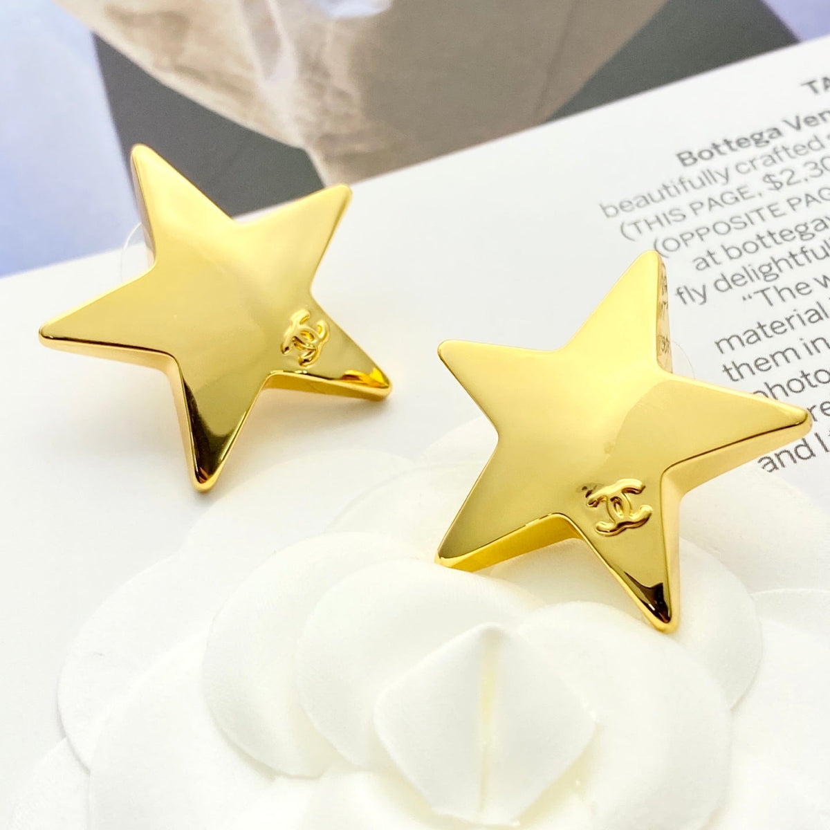 Martin Graham stud earrings in polished metal-tone – detail view