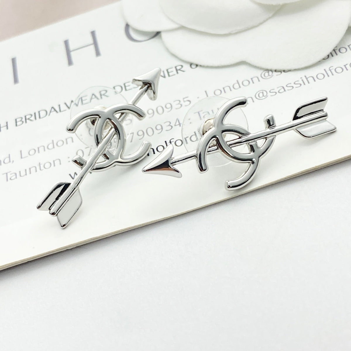 Martin Graham stud earrings in polished metal-tone – detail view