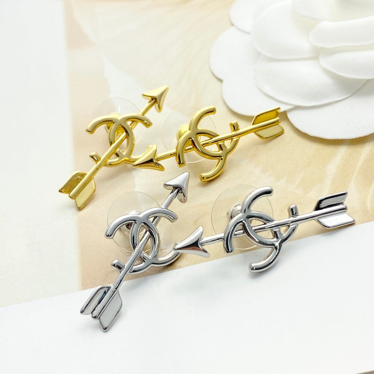 Martin Graham stud earrings in polished metal-tone – detail view