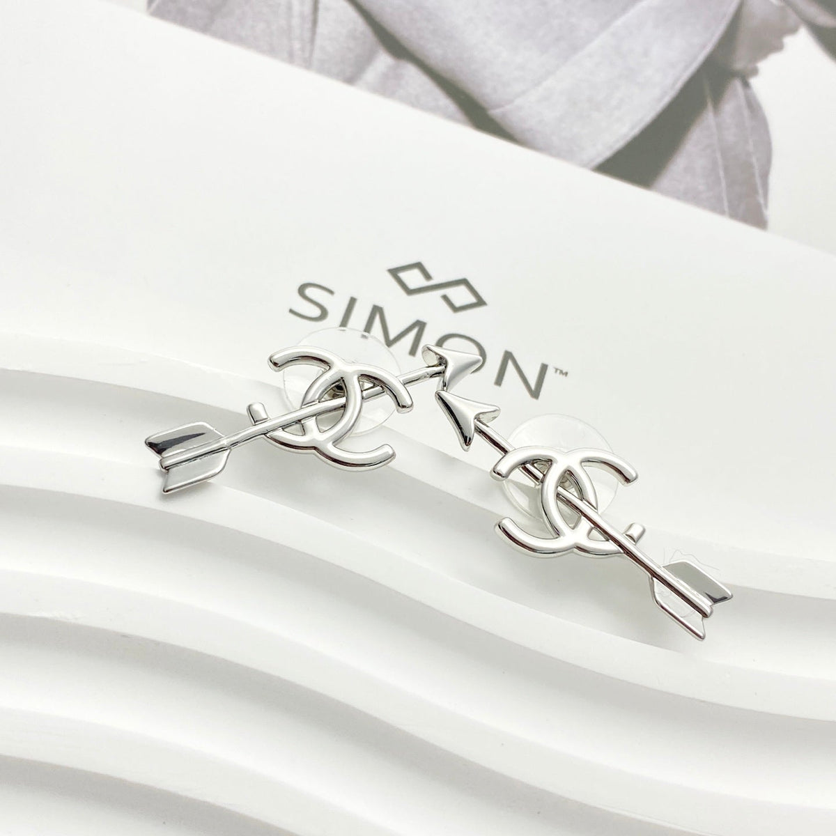 Martin Graham stud earrings in polished metal-tone – side detail