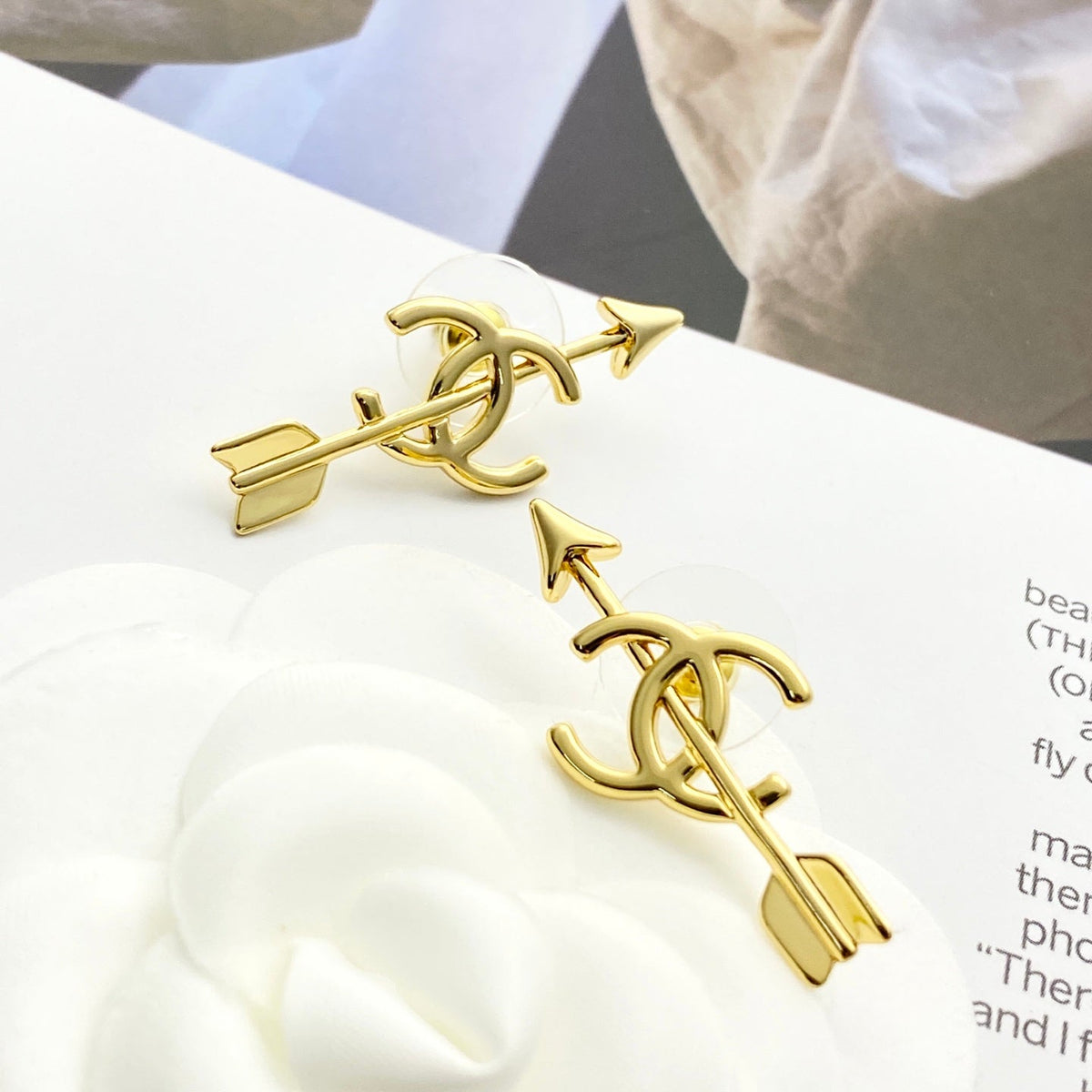 Martin Graham stud earrings in polished metal-tone – styled product view
