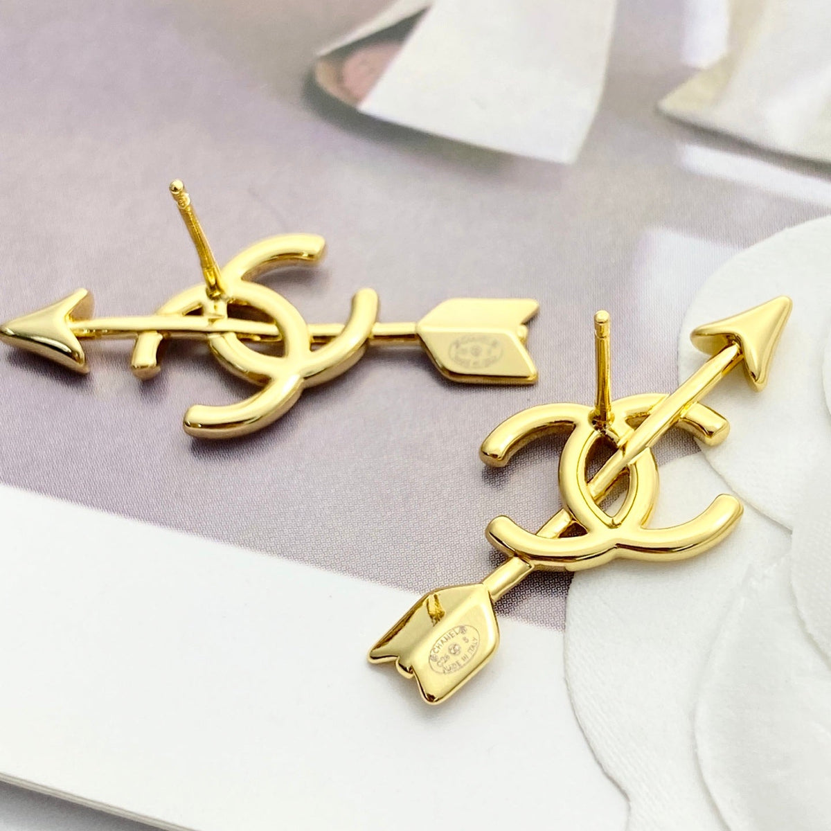 Martin Graham stud earrings in polished metal-tone – front product view
