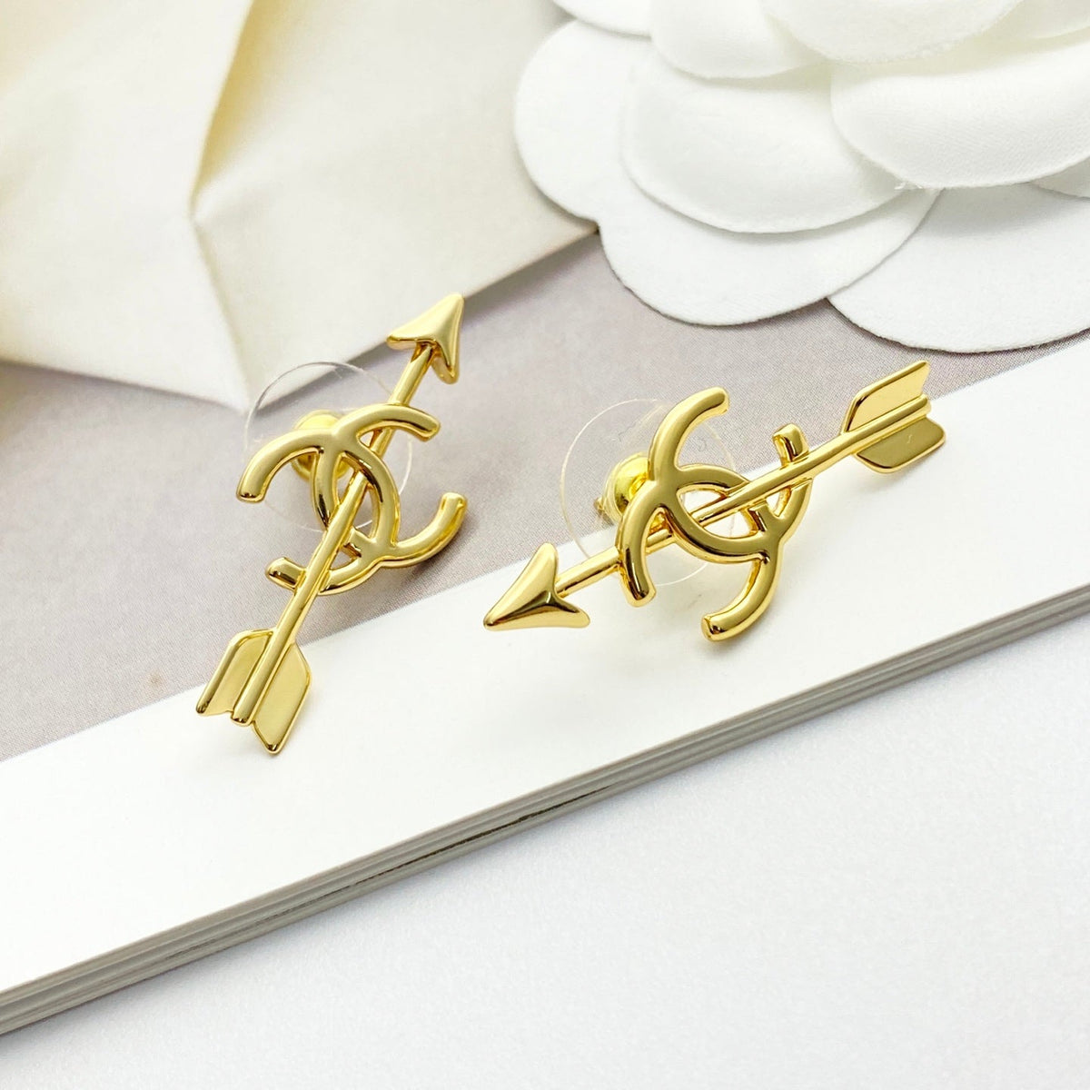 Martin Graham stud earrings in polished metal-tone – side detail