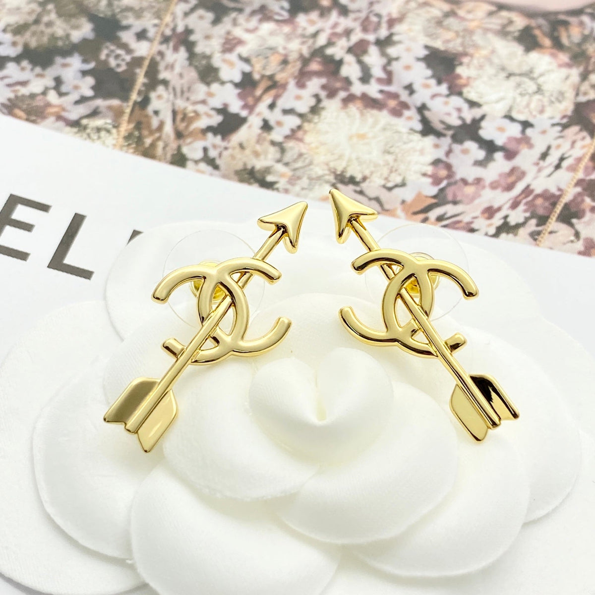 Martin Graham stud earrings in polished metal-tone – detail view