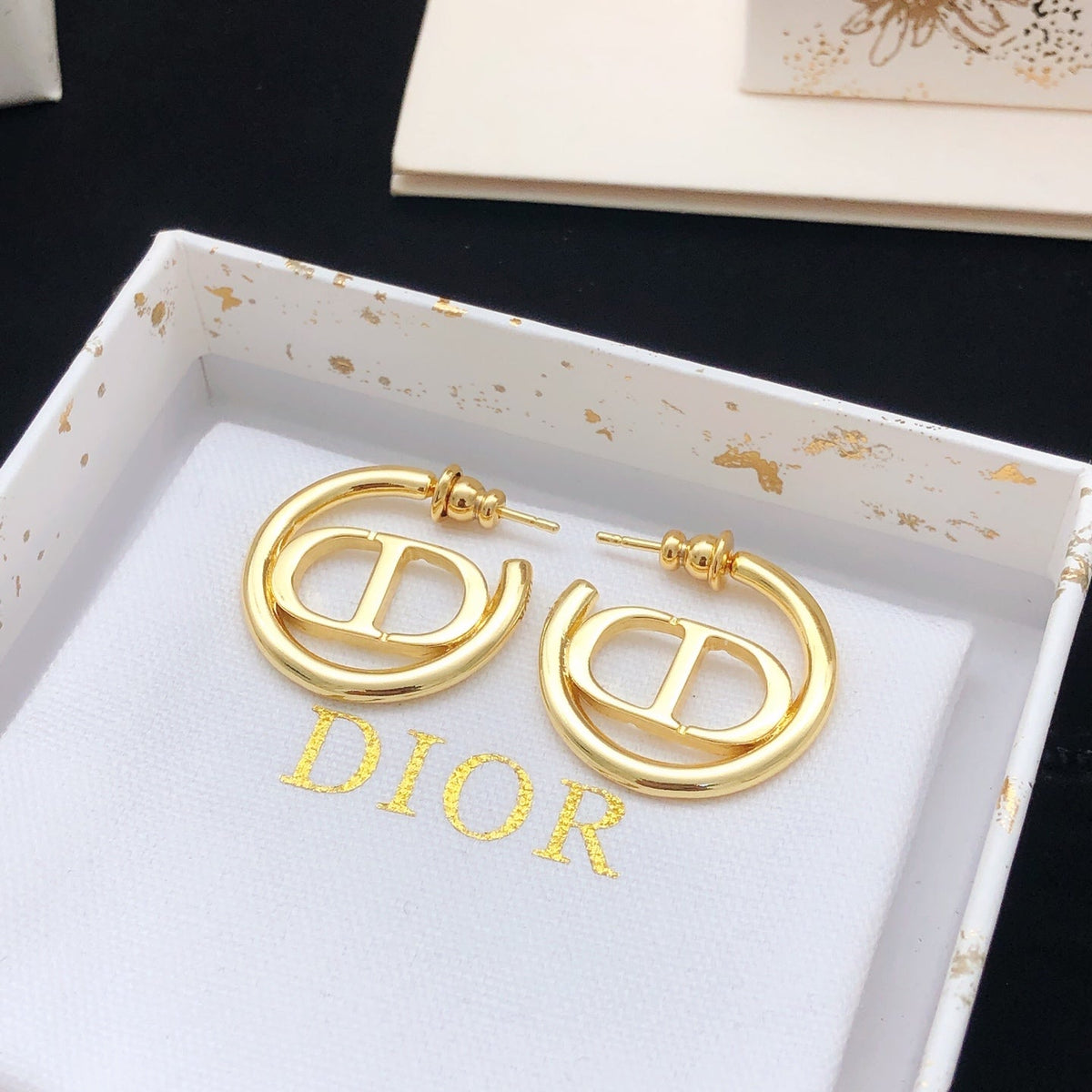 Martin Graham earrings in polished metal-tone