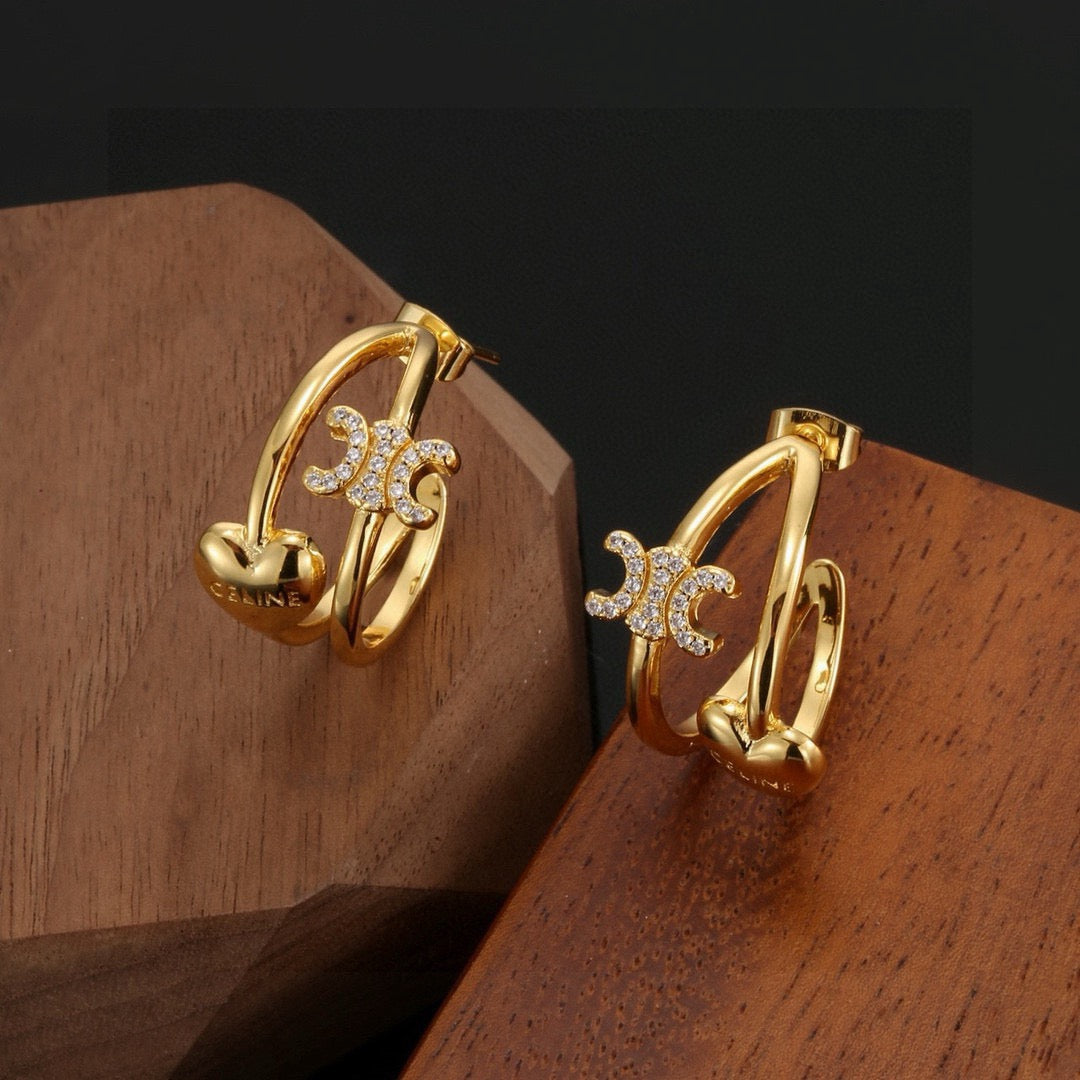 Martin Graham stud earrings in polished metal-tone