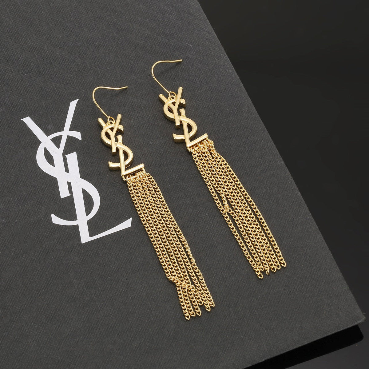 Martin Graham stud earrings in polished metal-tone – close-up detail
