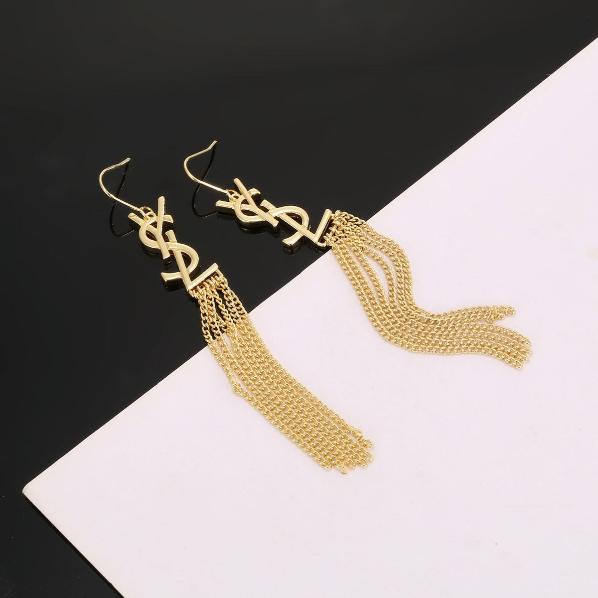 Martin Graham stud earrings in polished metal-tone – detail view