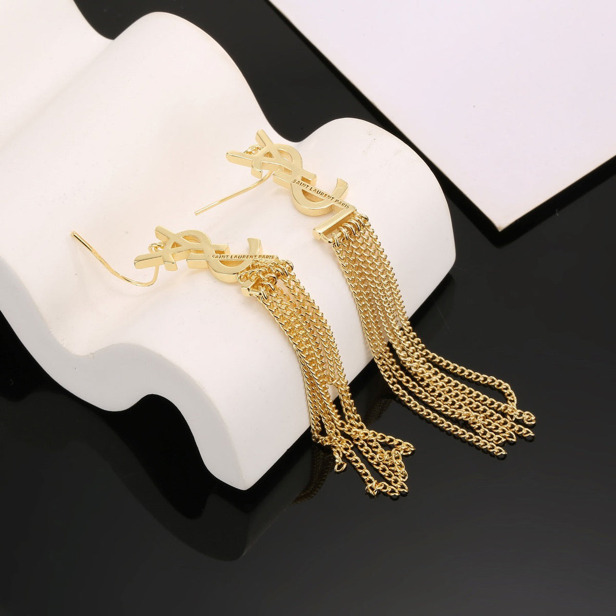 Martin Graham stud earrings in polished metal-tone – front product view