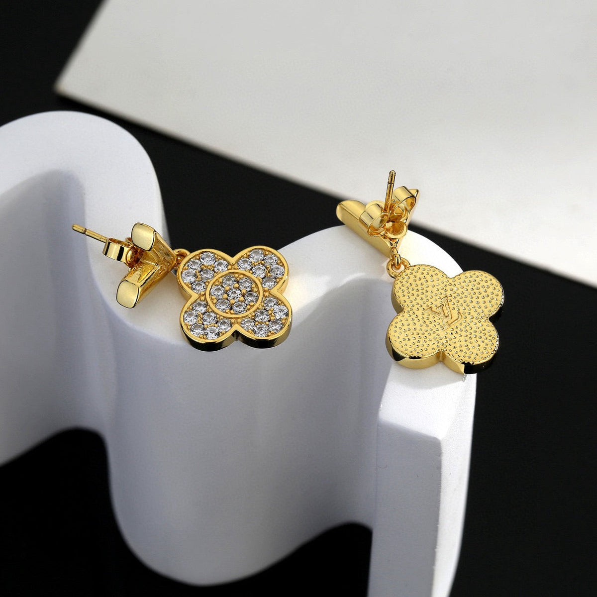 Martin Graham stud earrings in polished metal-tone – side detail