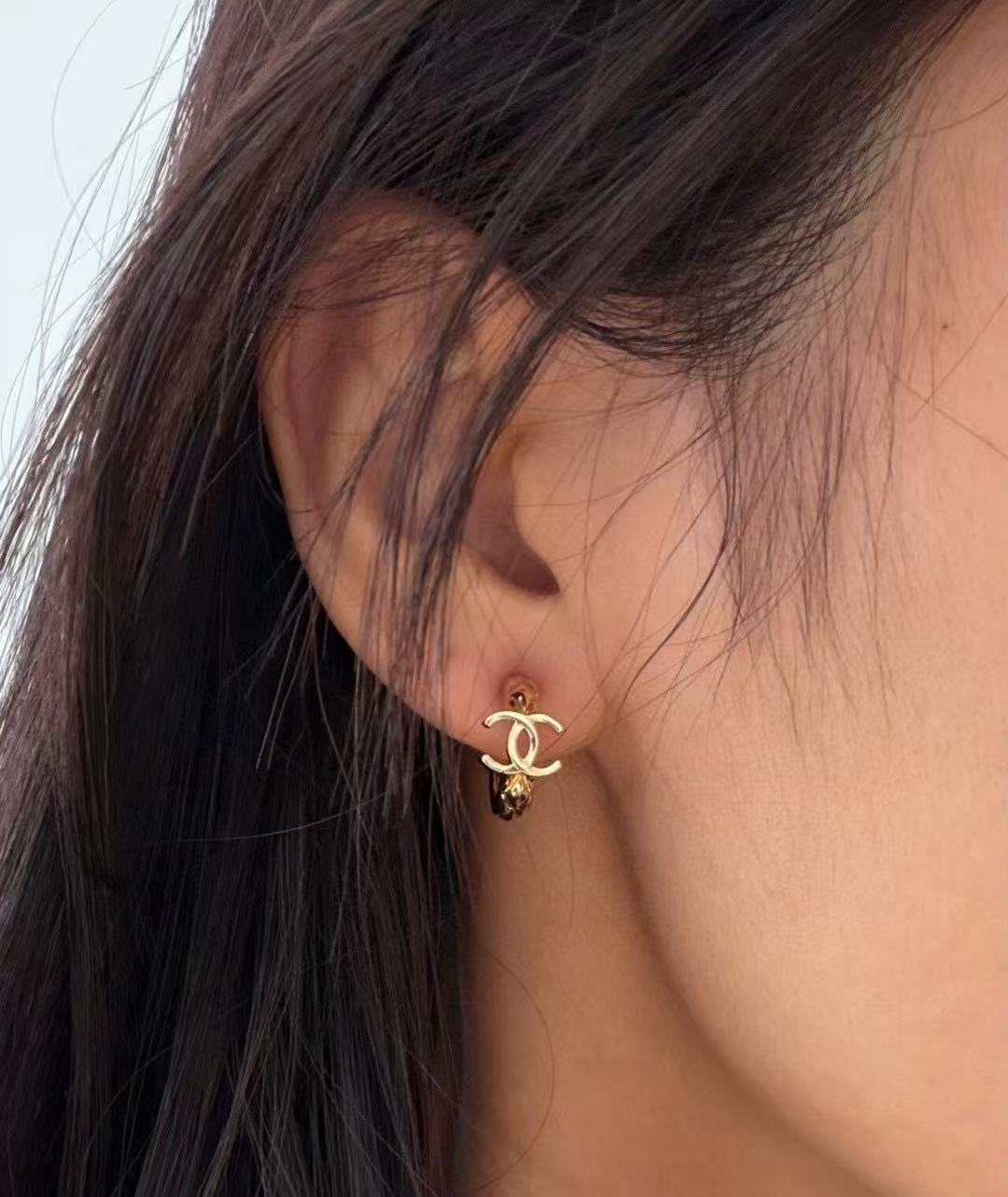 Martin Graham stud earrings in polished metal-tone – front product view