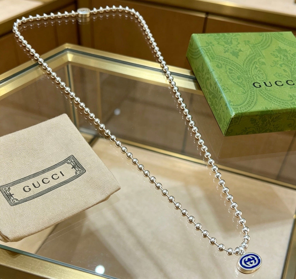 Martin Graham pendant necklace in polished metal-tone – styled product view