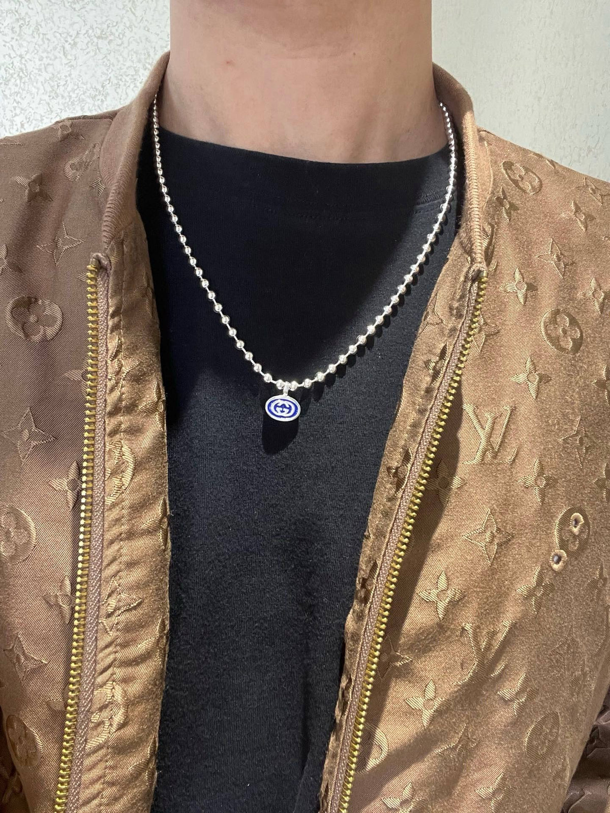 Martin Graham pendant necklace in polished metal-tone – side detail