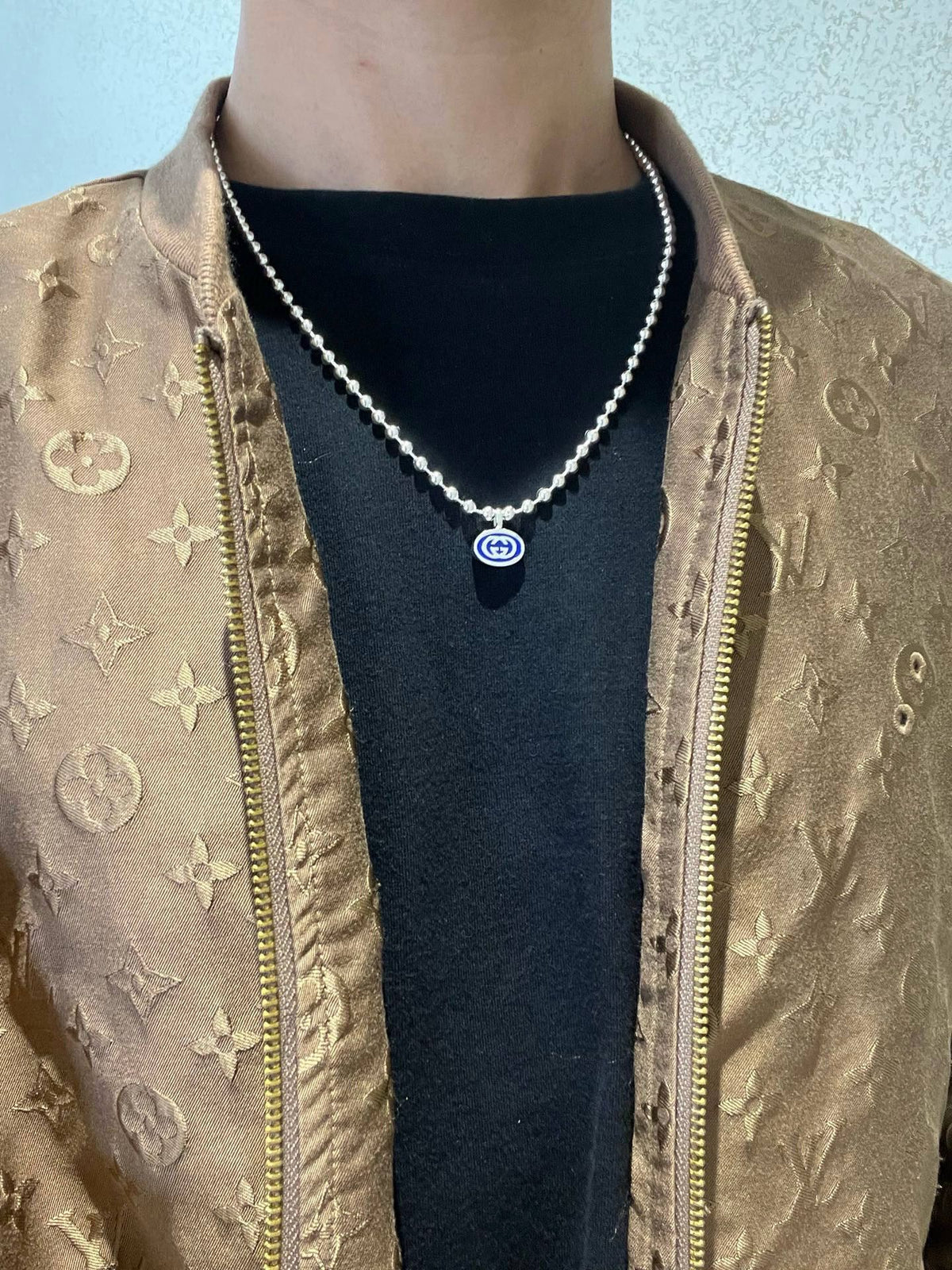 Martin Graham pendant necklace in polished metal-tone – detail view