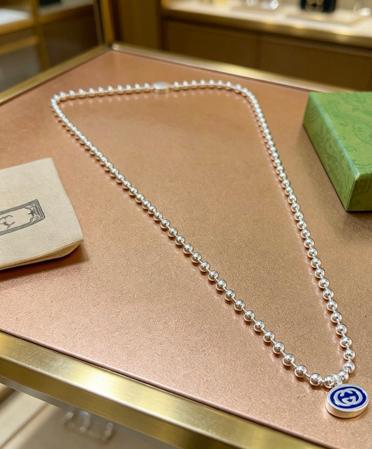Martin Graham pendant necklace in polished metal-tone – detail view