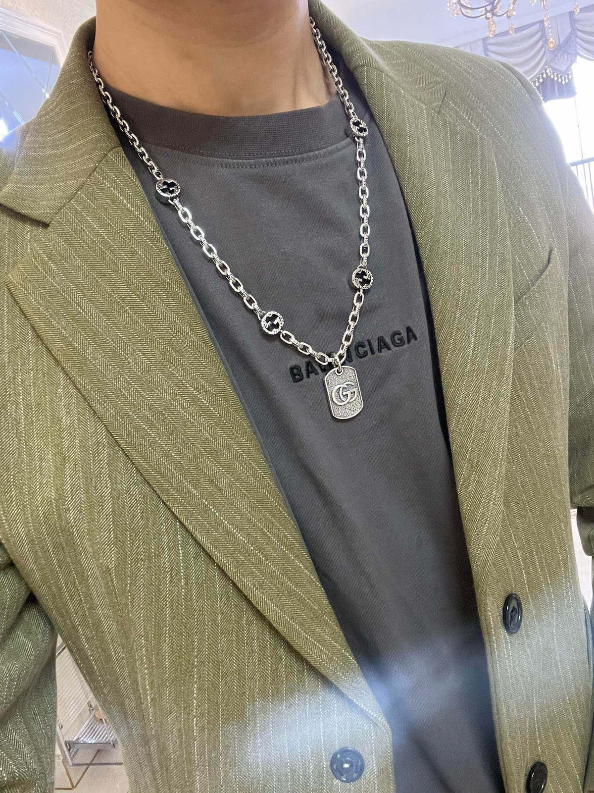 Martin Graham pendant necklace in polished metal-tone – side detail