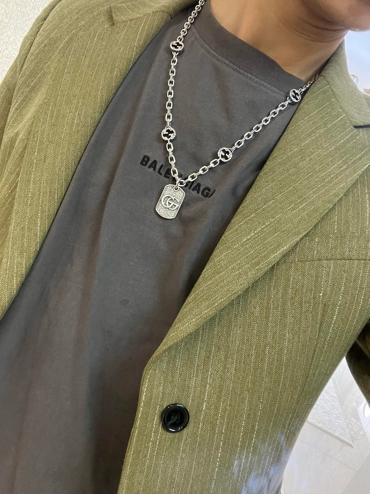 Martin Graham pendant necklace in polished metal-tone – detail view