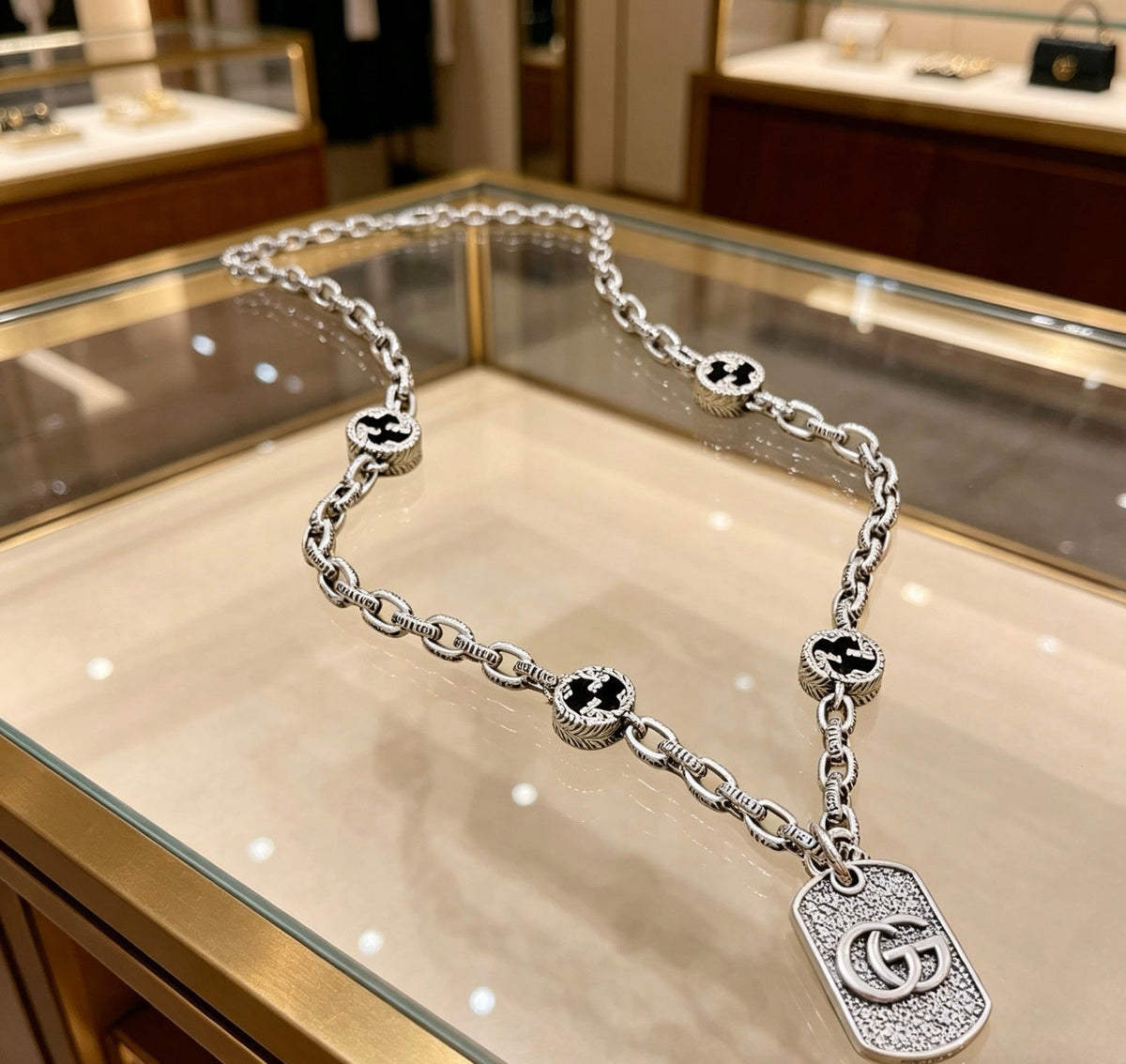 Martin Graham pendant necklace in polished metal-tone – front product view
