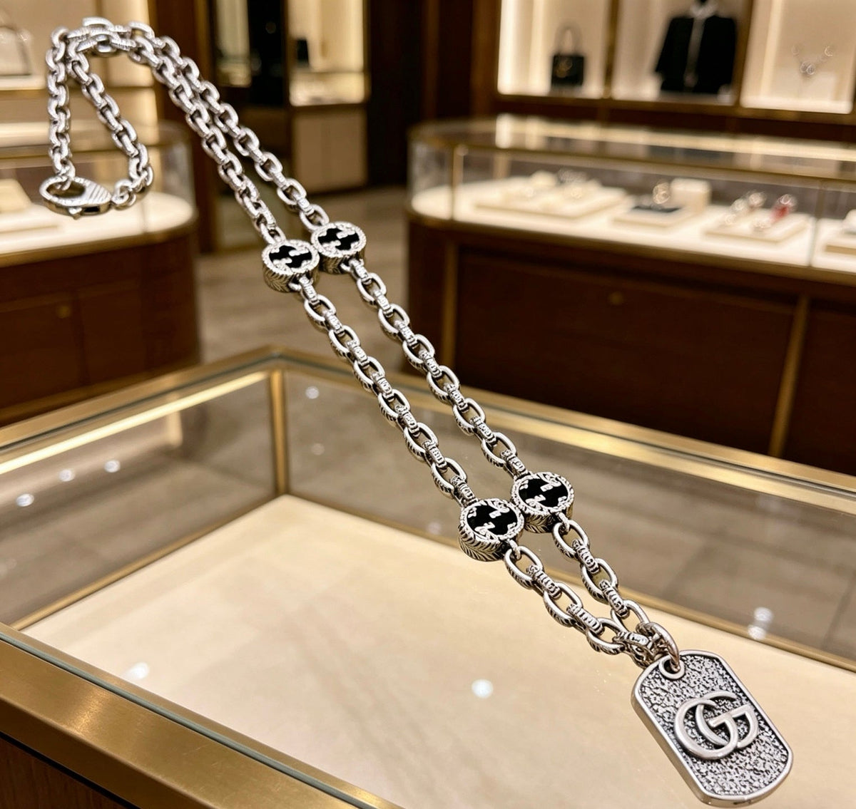 Martin Graham pendant necklace in polished metal-tone – styled product view