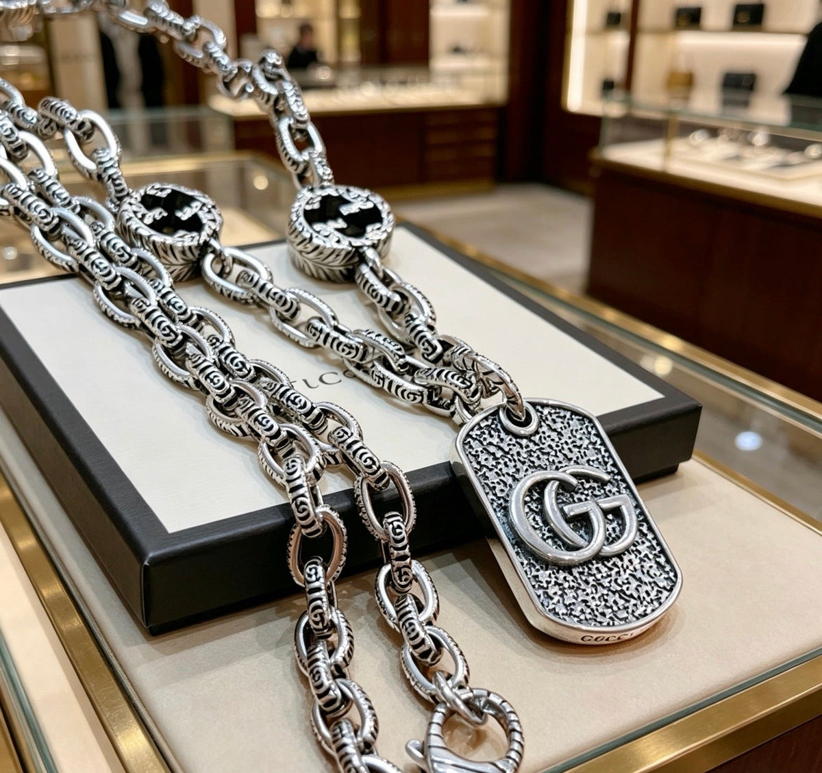 Martin Graham pendant necklace in polished metal-tone – close-up detail
