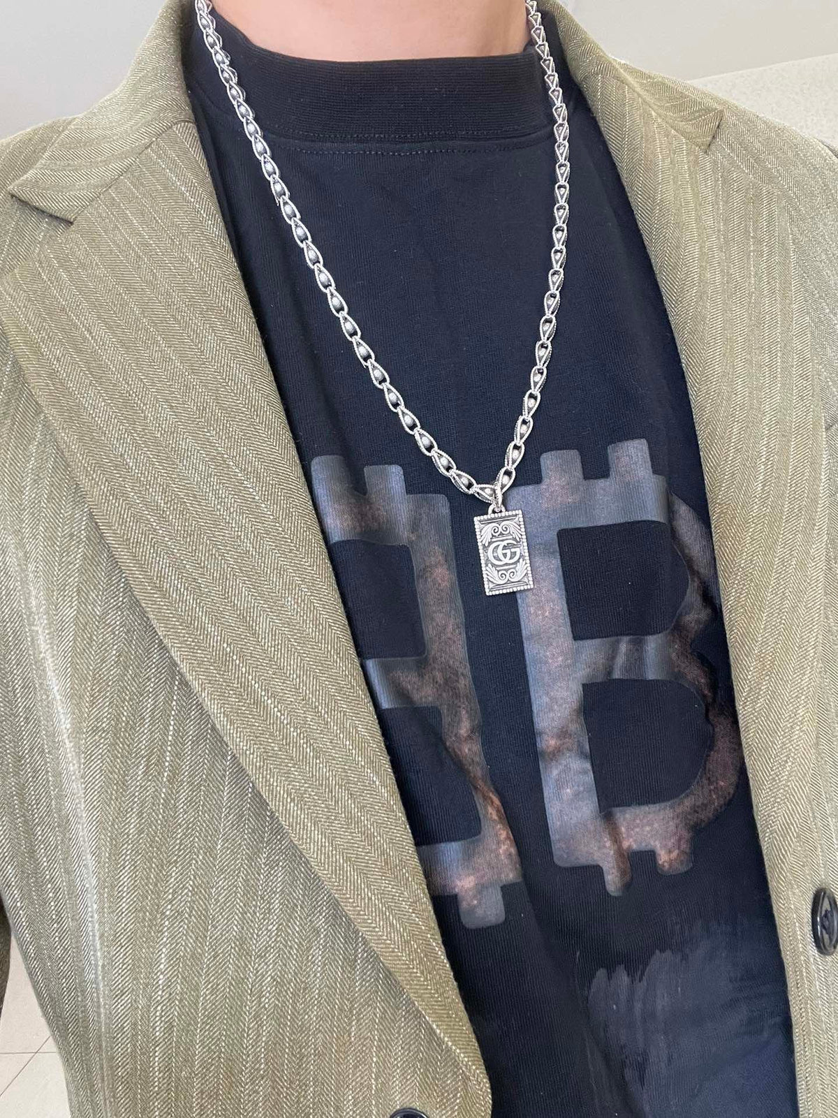 Martin Graham pendant necklace in polished metal-tone – detail view
