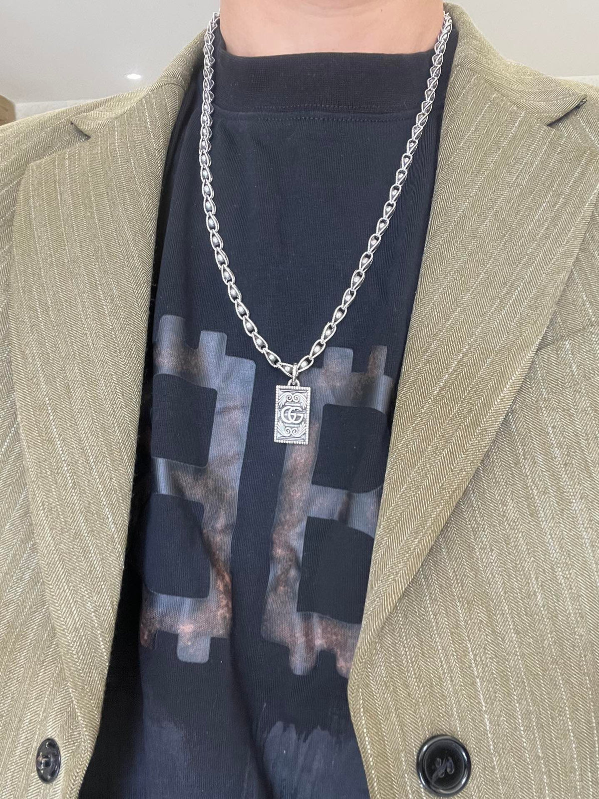Martin Graham pendant necklace in polished metal-tone – detail view