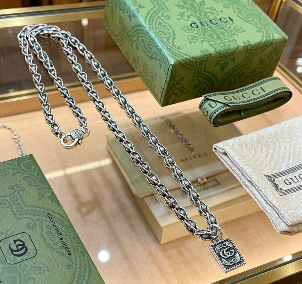 Martin Graham pendant necklace in polished metal-tone – close-up detail