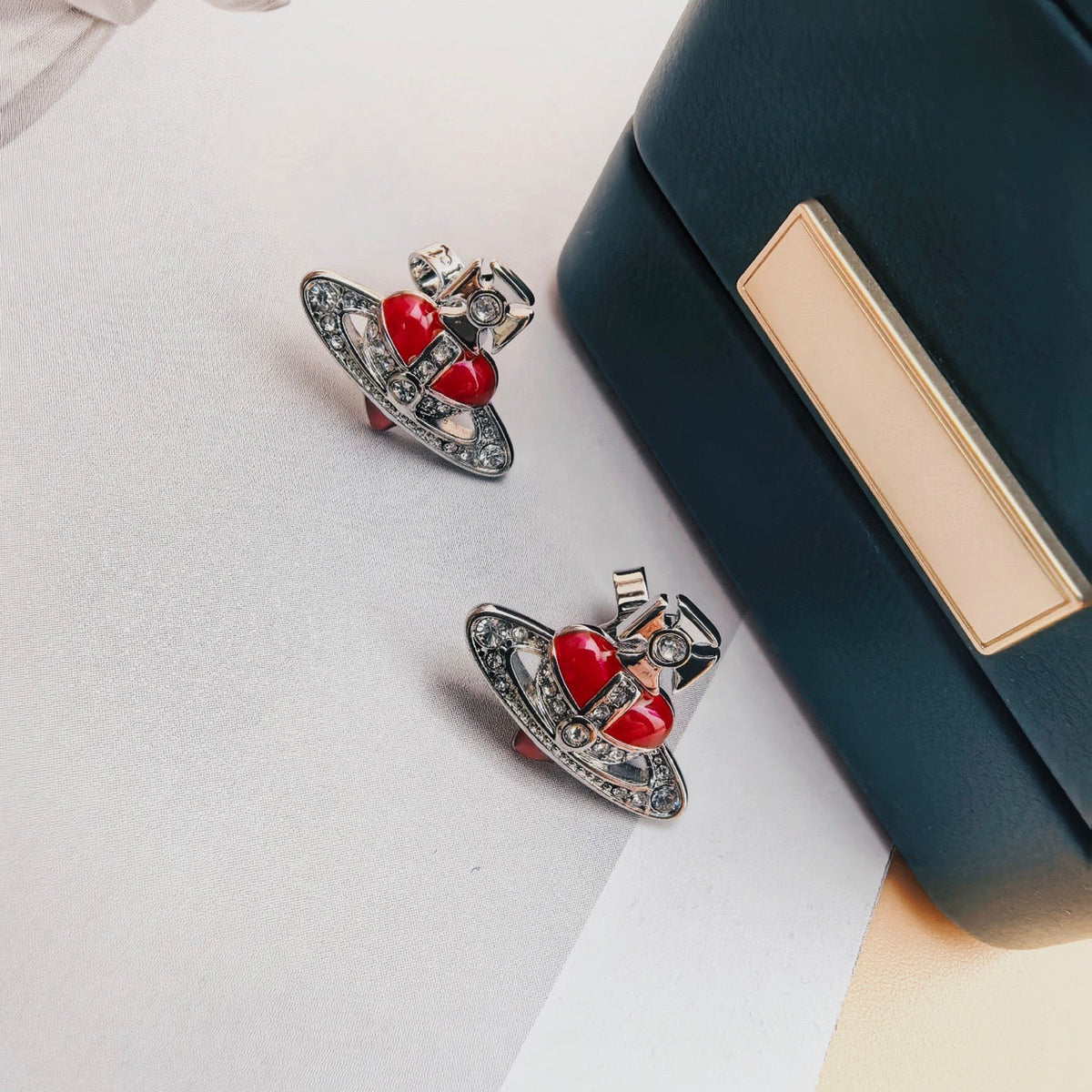 Martin Graham stud earrings in polished metal-tone – detail view