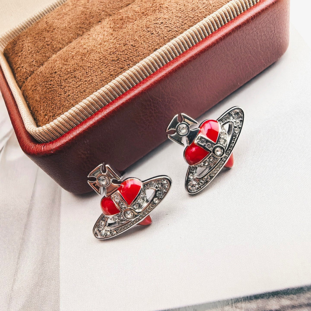 Martin Graham stud earrings in polished metal-tone – side detail