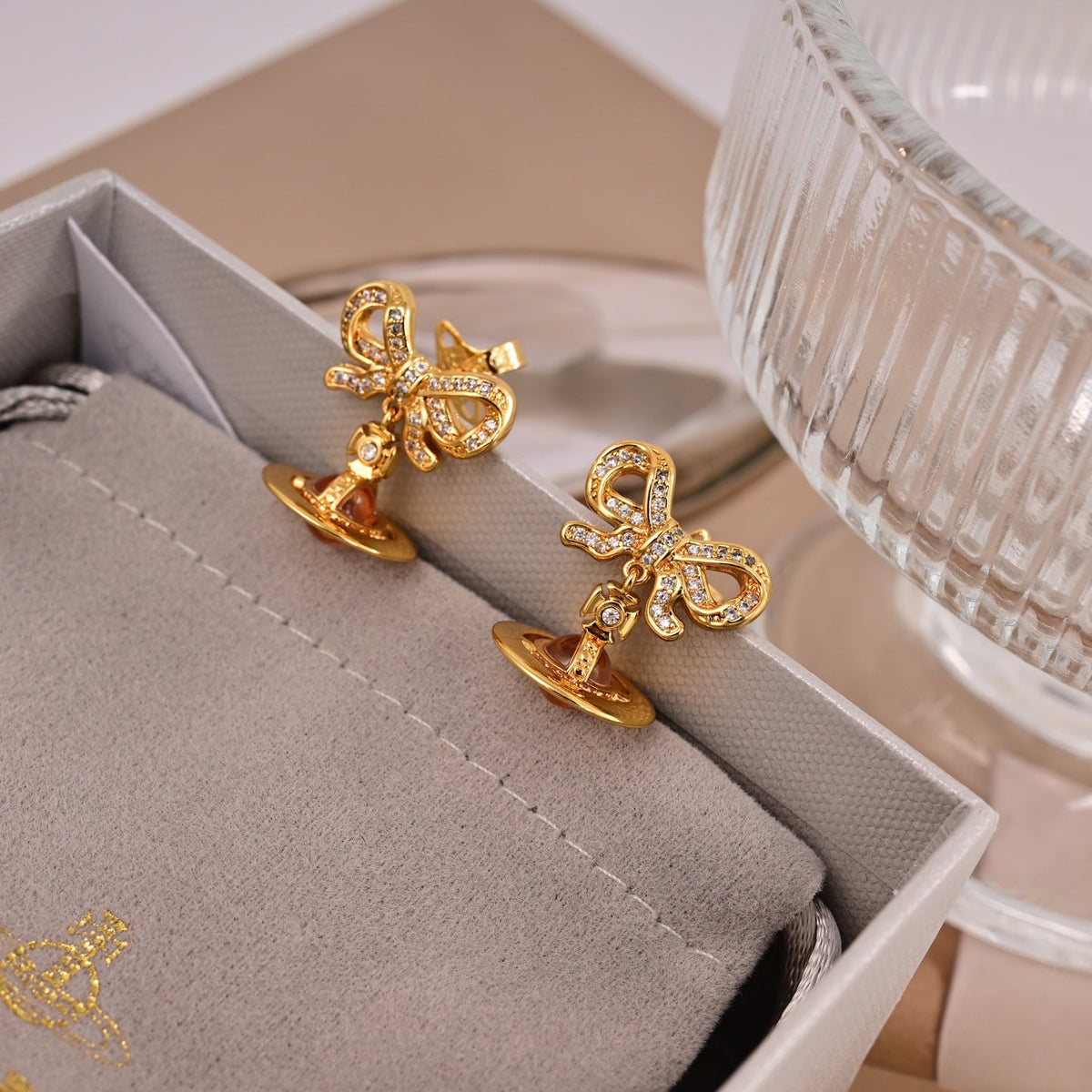 Martin Graham stud earrings in polished metal-tone – close-up detail