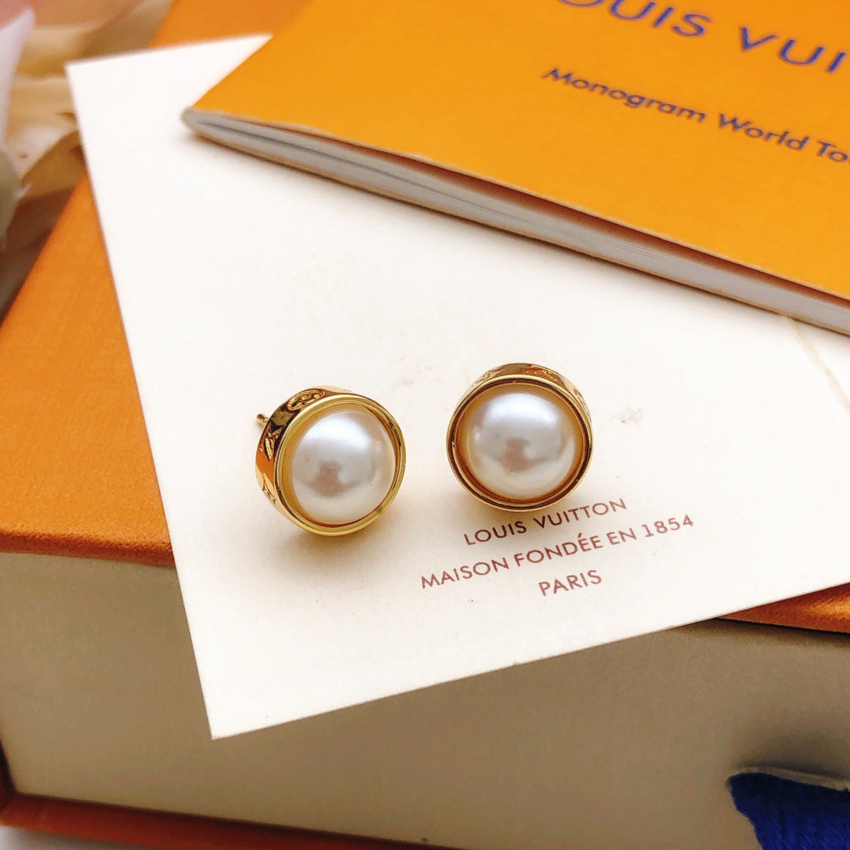 Martin Graham stud earrings in polished metal-tone – front product view