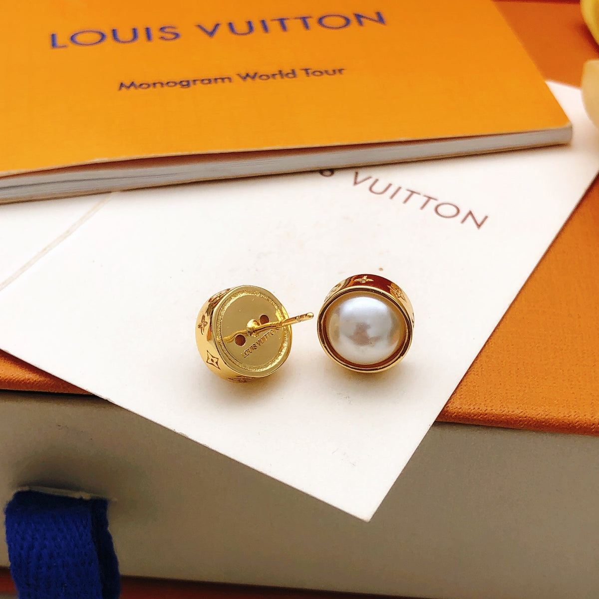 Martin Graham stud earrings in polished metal-tone – detail view
