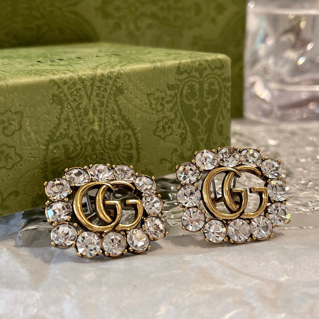 Martin Graham stud earrings in polished metal-tone – front product view