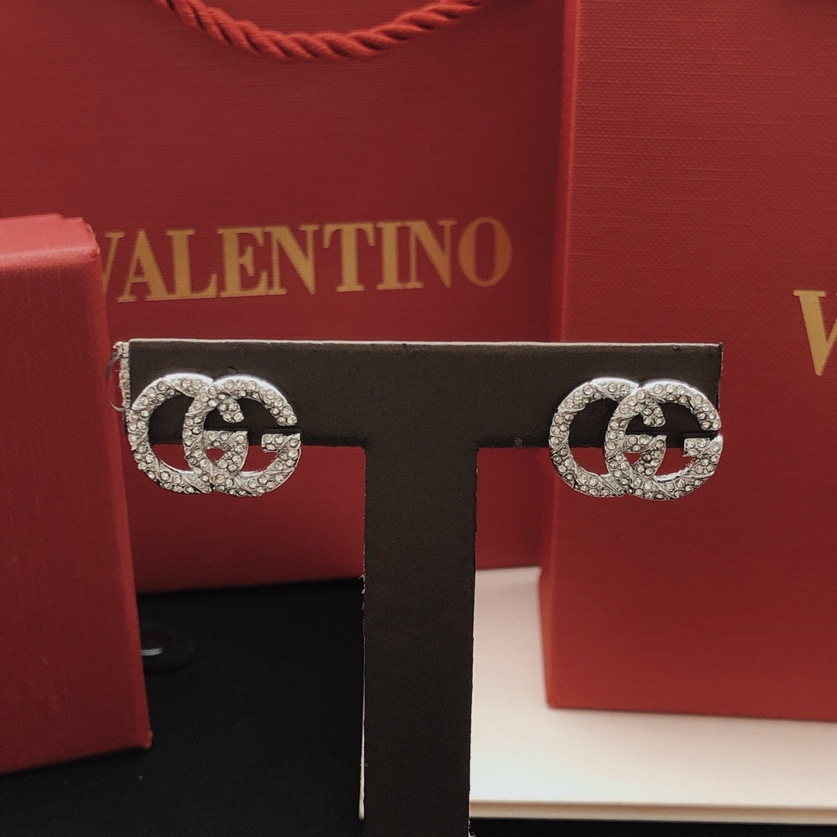Martin Graham stud earrings in polished metal-tone – front product view