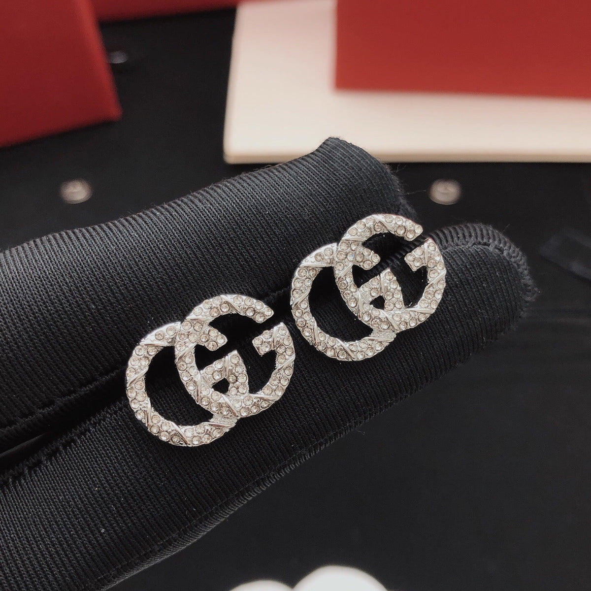 Martin Graham stud earrings in polished metal-tone – front product view