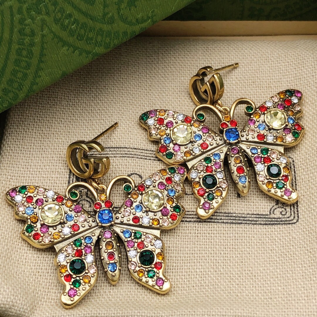 Martin Graham stud earrings in polished metal-tone – styled product view