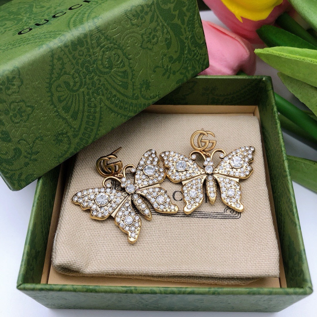 Martin Graham stud earrings in polished metal-tone – detail view