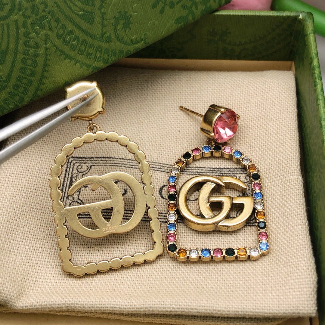 Martin Graham stud earrings in polished metal-tone – front product view