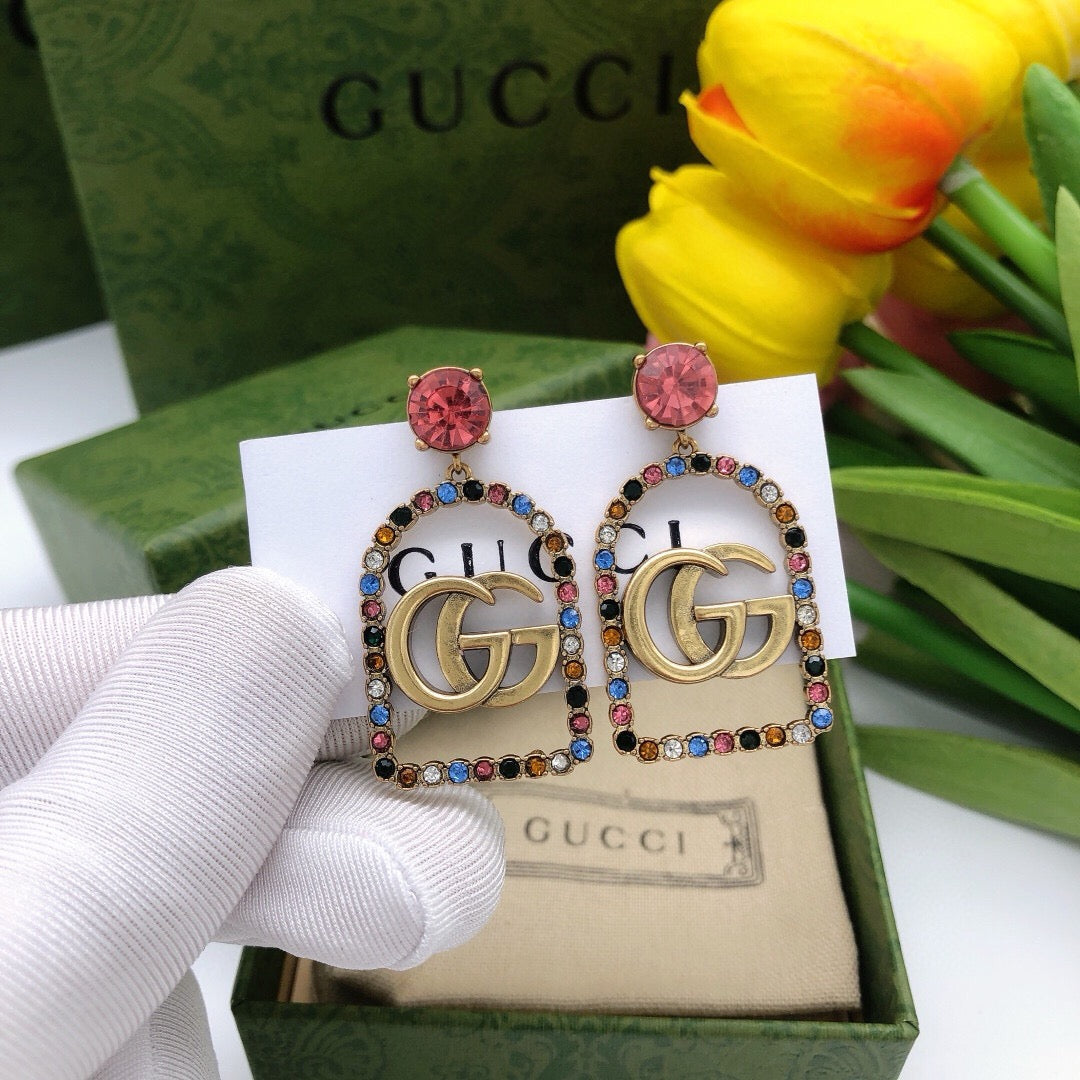 Martin Graham stud earrings in polished metal-tone – detail view