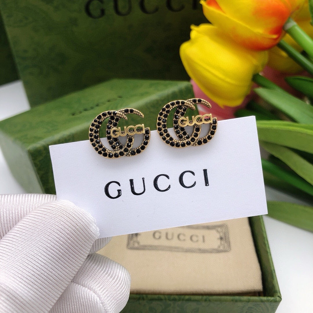 Martin Graham stud earrings in polished metal-tone – front product view