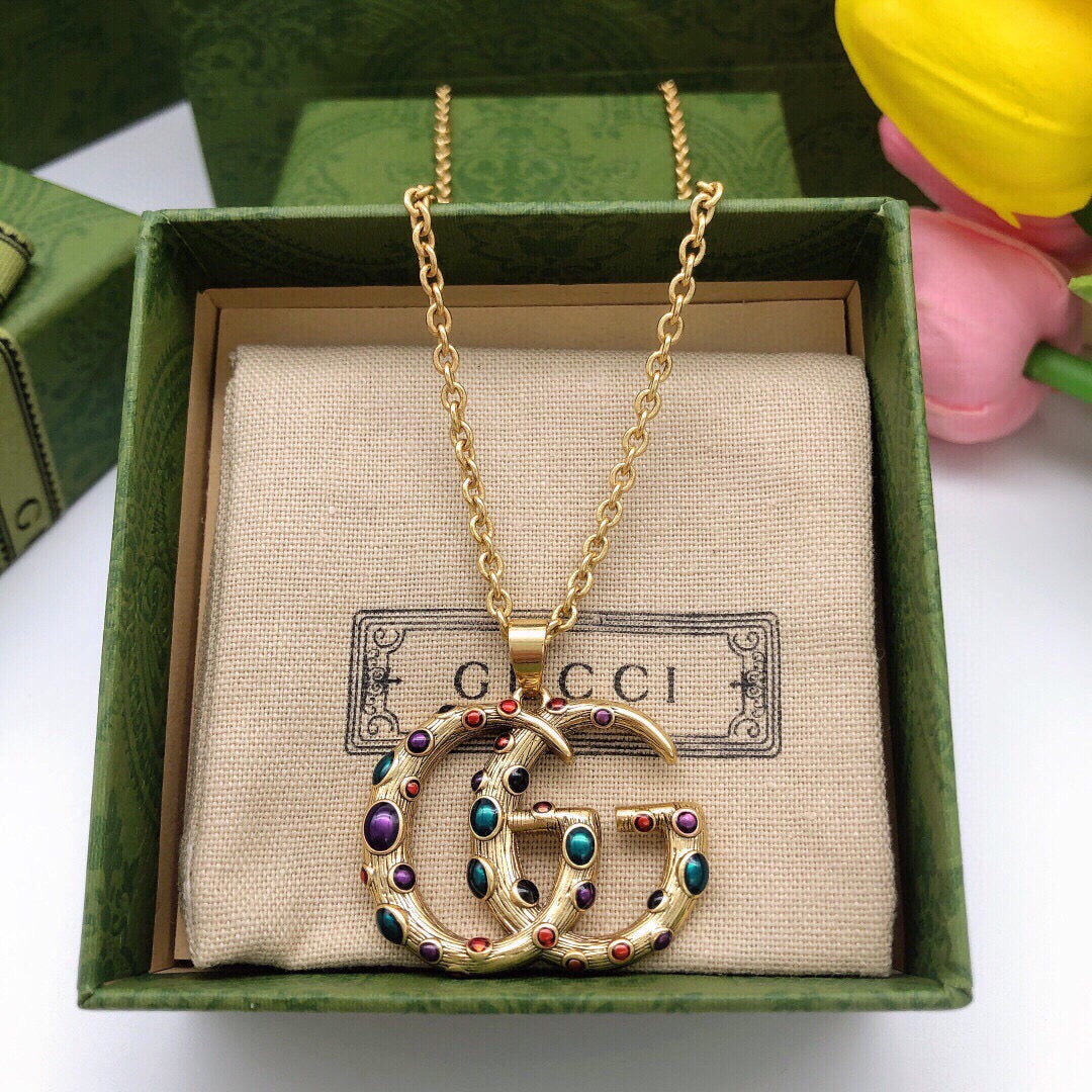 Martin Graham pendant necklace in polished metal-tone – side detail