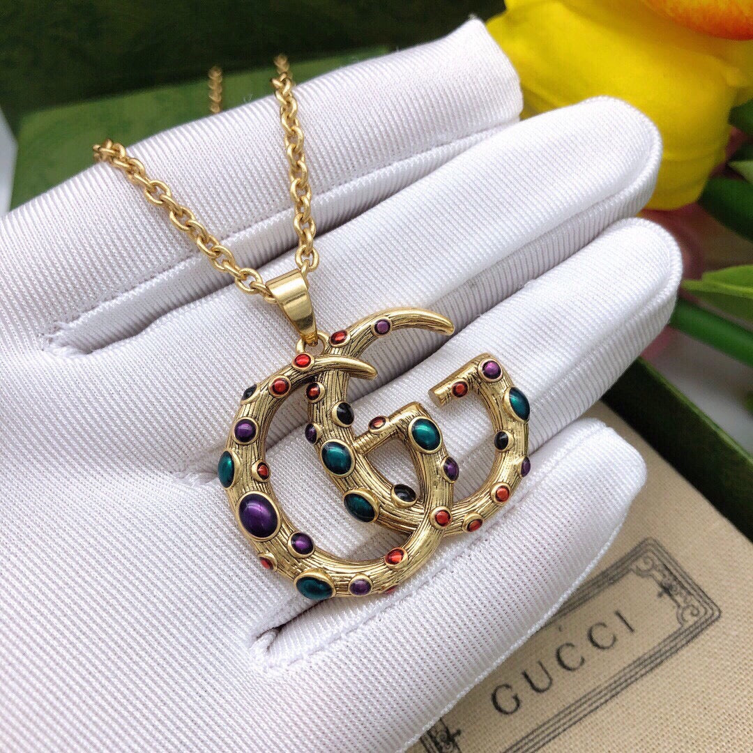 Martin Graham pendant necklace in polished metal-tone – close-up detail