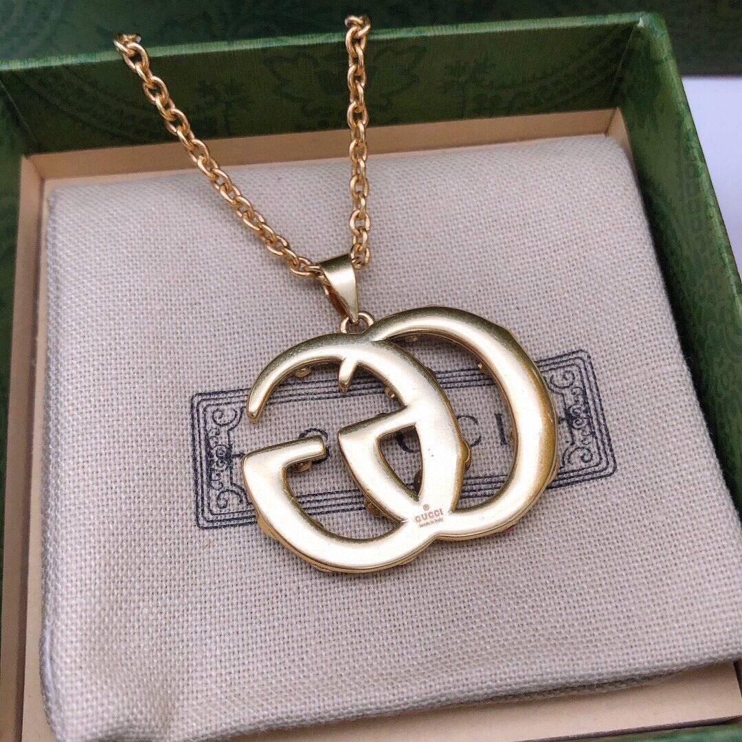 Martin Graham pendant necklace in polished metal-tone – styled product view